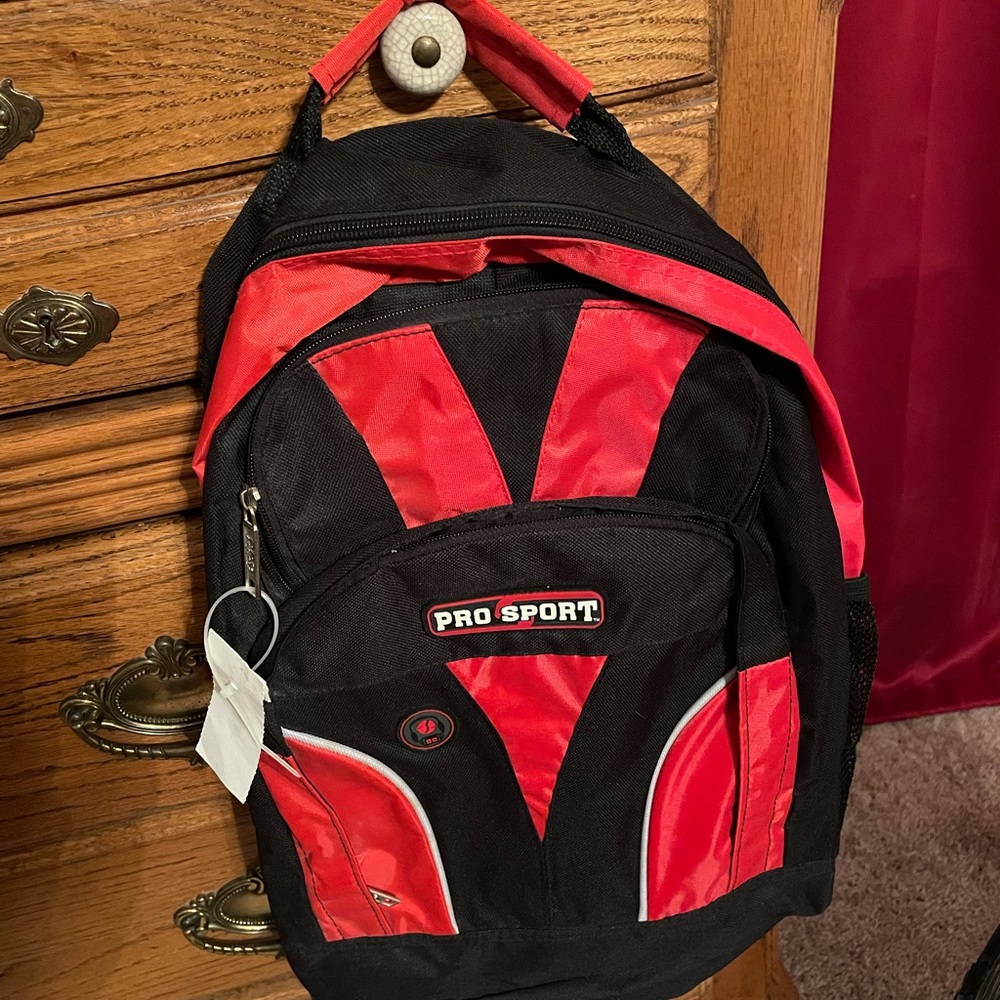 NWT Pro Sport Red & Black Back pack has headphone plug in on bag